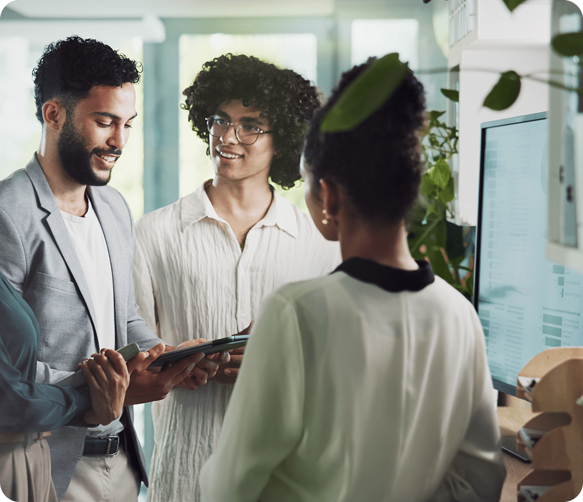 Group meeting around computer screen