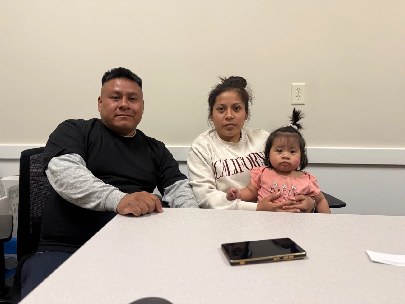 Family sitting together at a table.