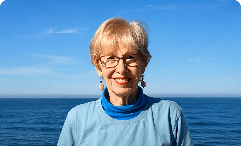 Smiling person by the ocean